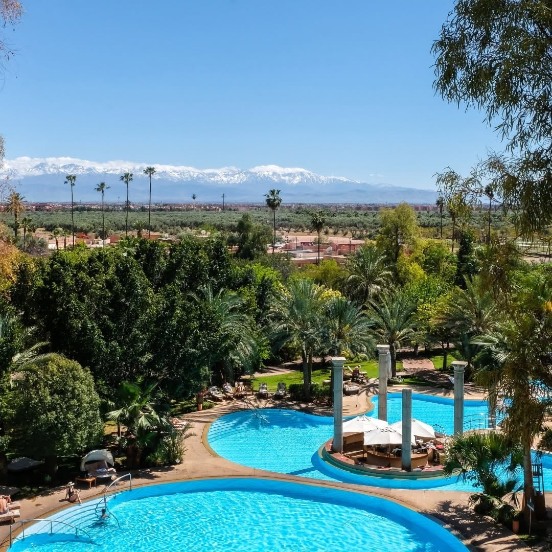 The gardens of Es Saadi Palace, with the Atlas Mountains. Courtesy Es Saadi