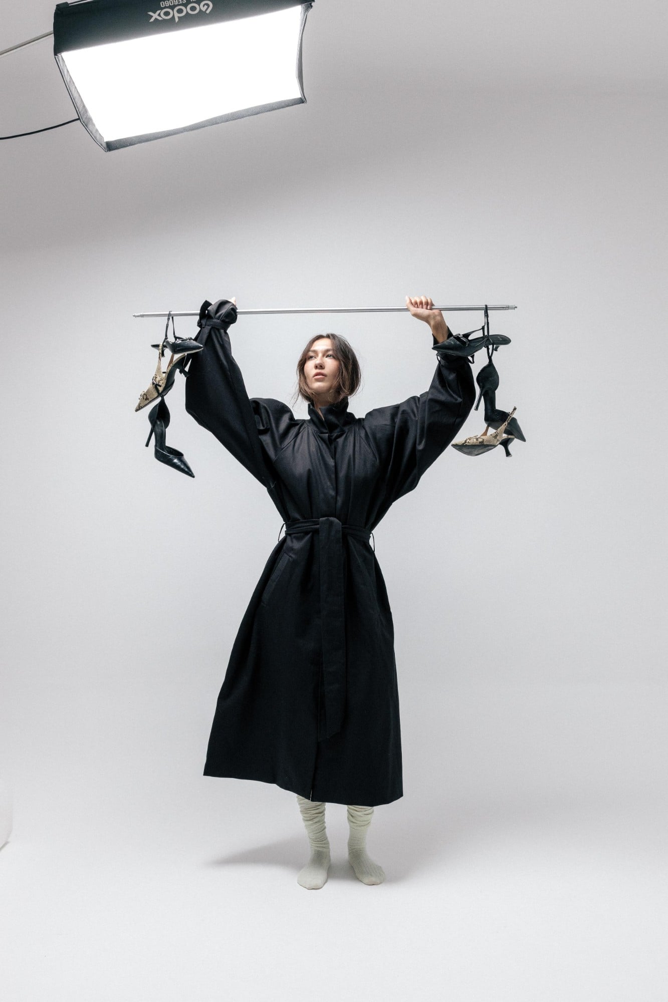 A look by House of Sensi, black coat and shoes. Courtesy House of Sensi