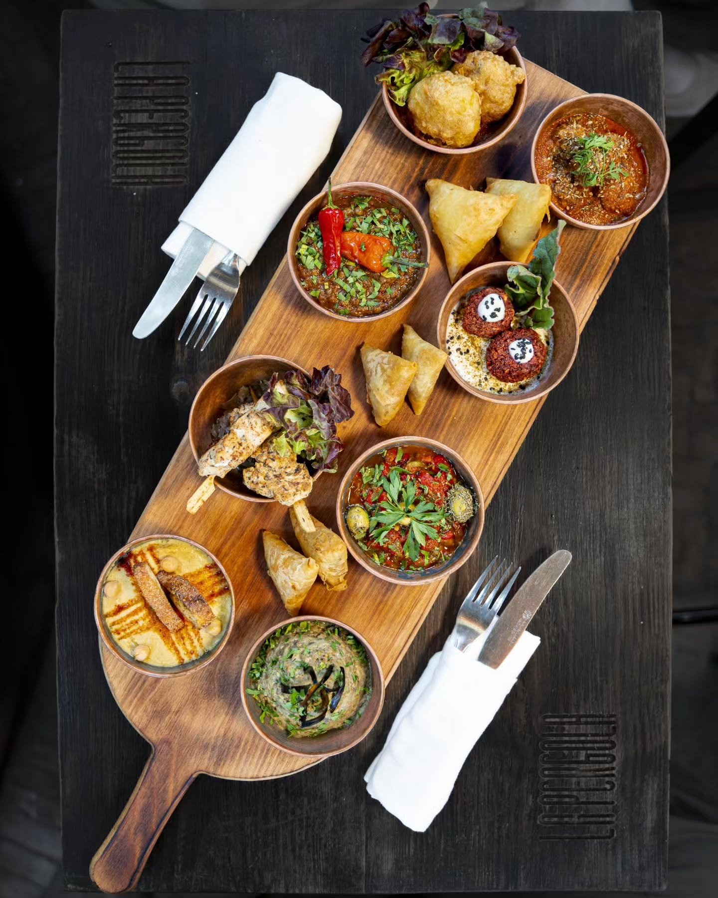 The Moroccan tapas board at La Pergola, small bowls of dips and fried bites