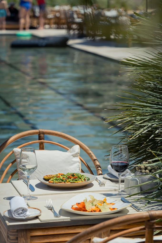 A table set by the pool at the Pool Garden